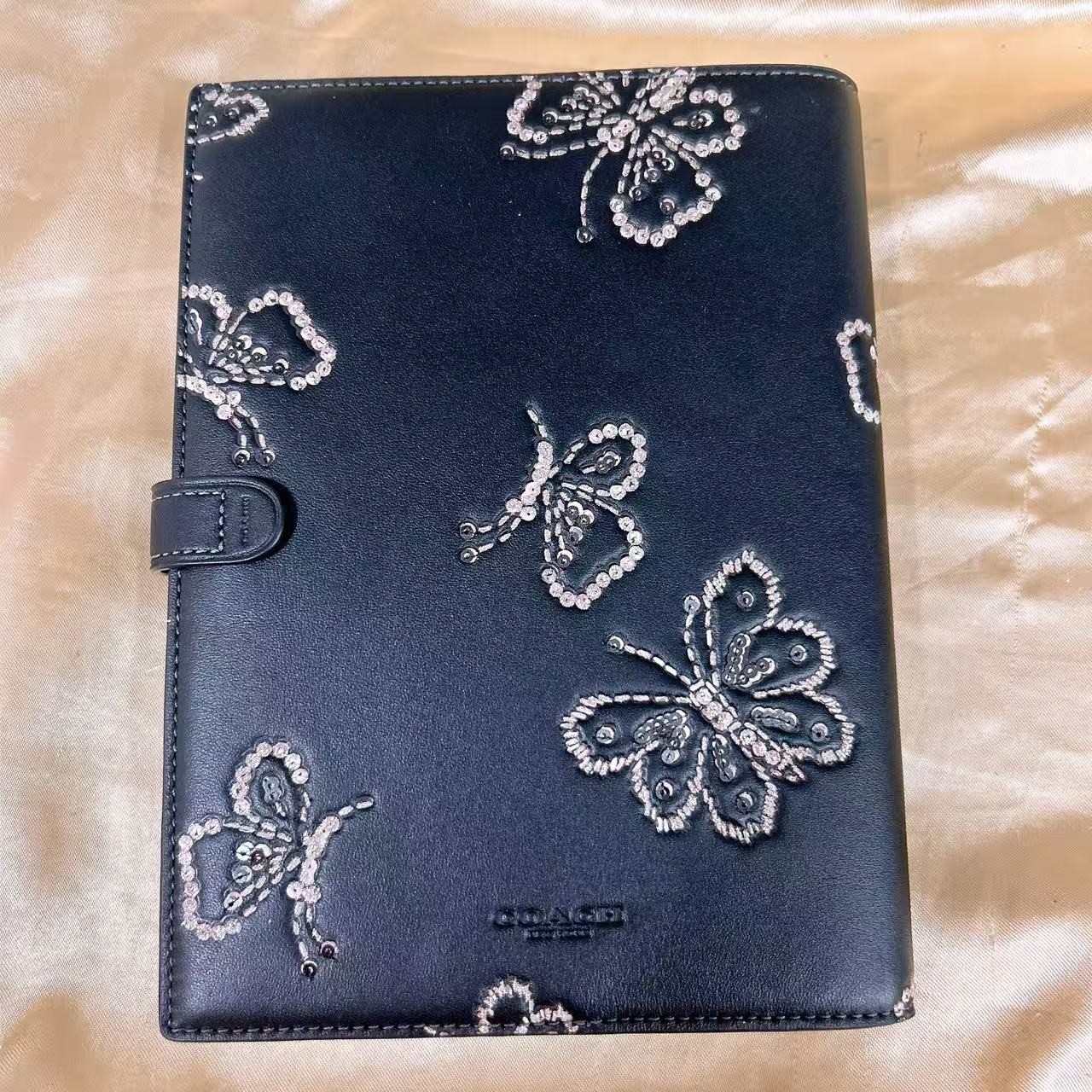 NWT Coach Notebook With Butterfly Print CCF42 (count 1) black color.